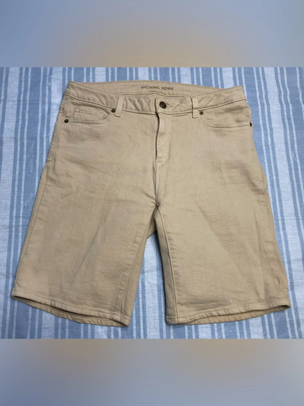 Michael Kors tan Bermuda shorts.
